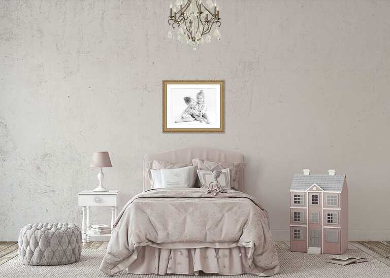 little girls bedroom with a picture of twin girls above bed in gold frame
