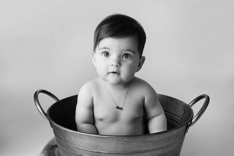 baby in metal tub
