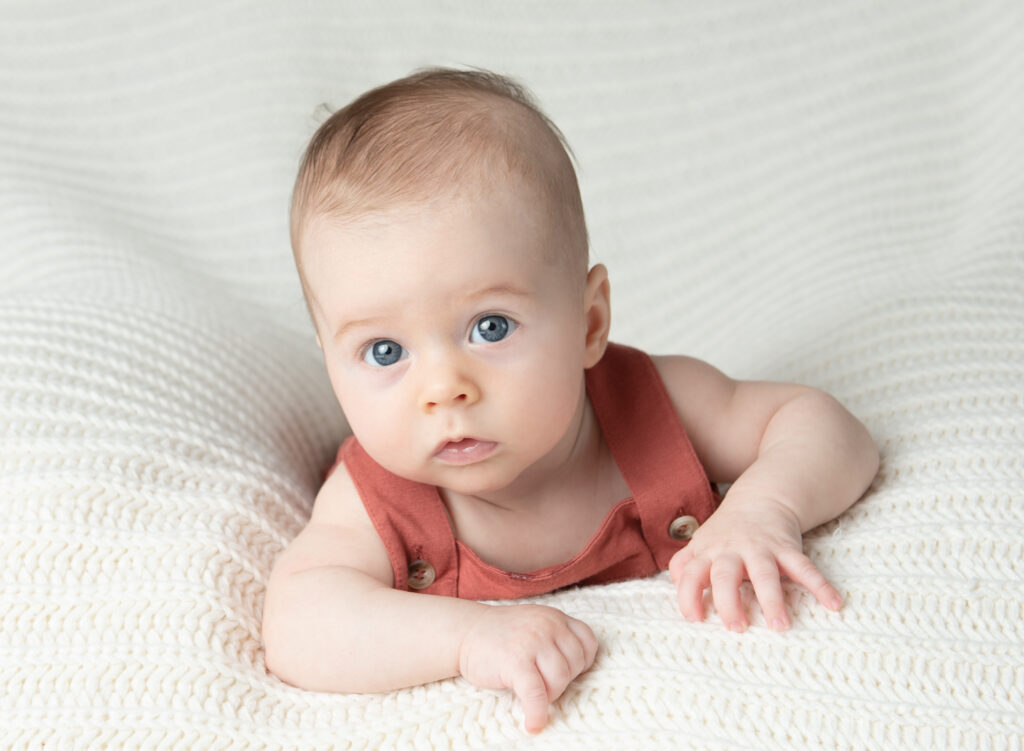 chicago baby portraits of 3 month old on tummy looking soulfully at camera