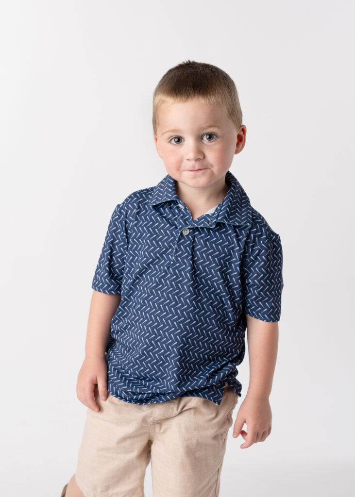 example of what to wear for school  pictures- young boy wearing a small print shirt posing for his school picture