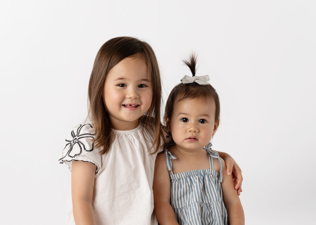 sisters posing for their school pictures